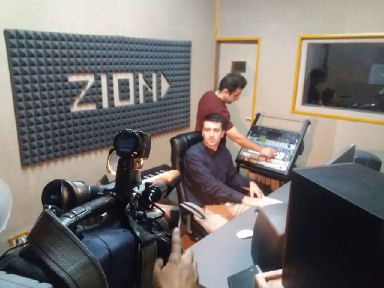 Euronews interviews Baron (Behruzi Sharifi) at the ZION studio while Dodikhudo Abdurahimov, his producer, works the mixing console, 2015
